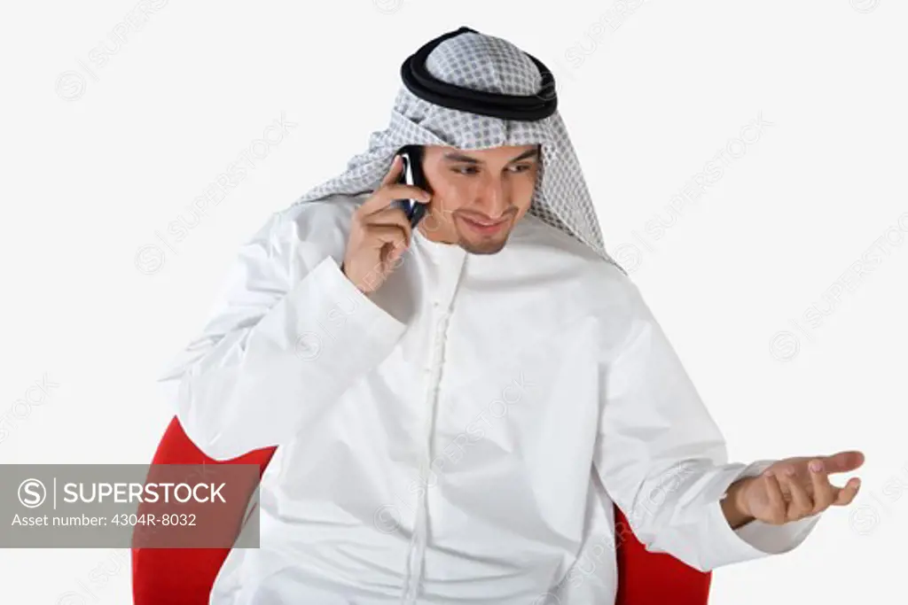 Young man on the phone, smiling, elevated view