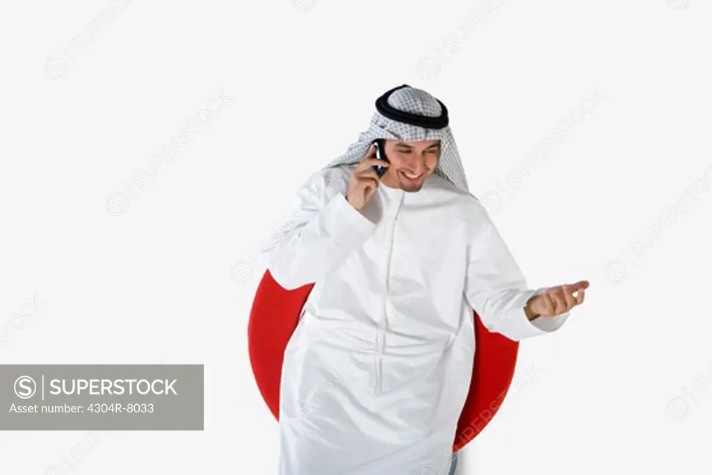 Young man on the phone, smiling, elevated view