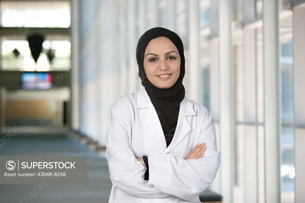 Portrait of female arab doctor at the hospital corridor.