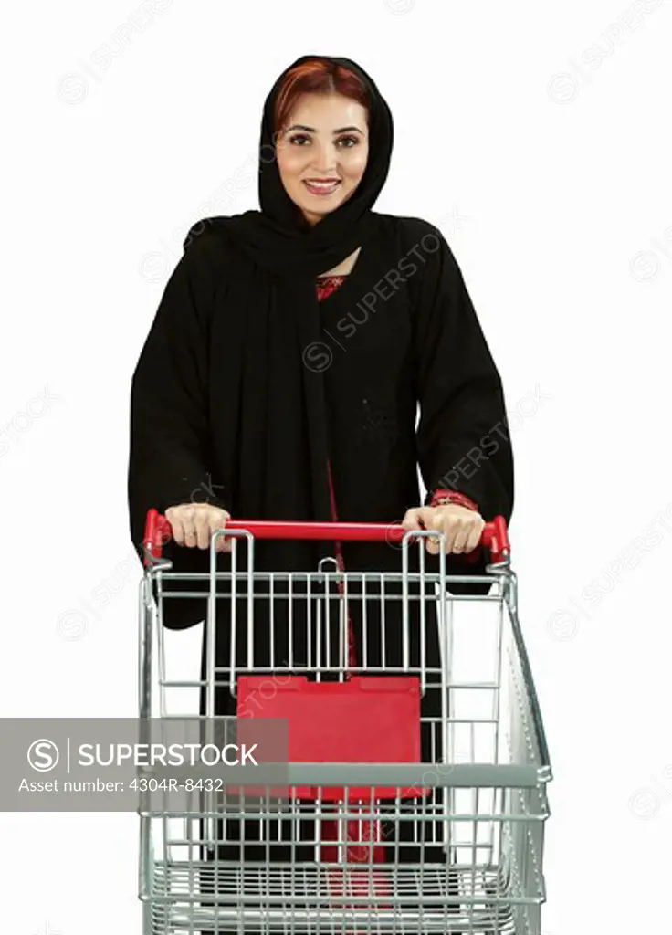 Arab woman with a empty shopping cart