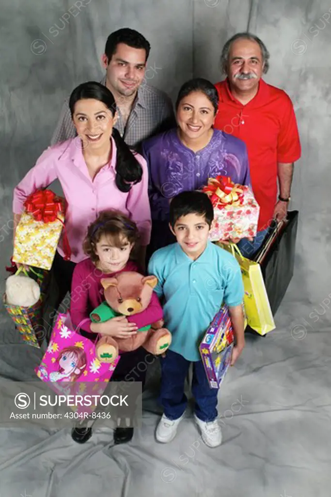 Family holding a gift and shopping bag