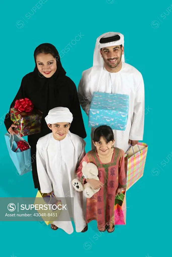 Arab Family holding a gift and shopping bag