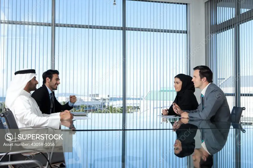 Multi-ethnic business people having a meeting in a conference room.