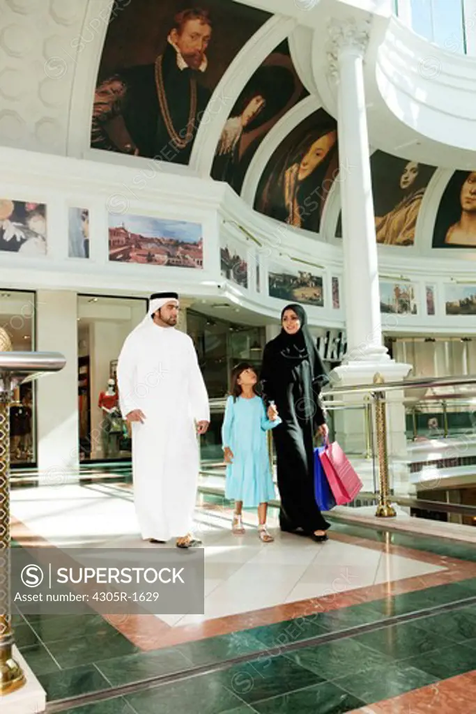 Arab Family with shopping bags at the mall.