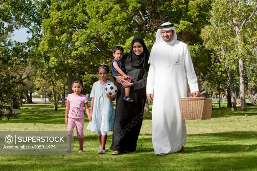 Arab family going on a picnic at the park.