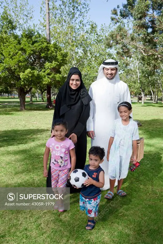 Portrait of arab family in the park.