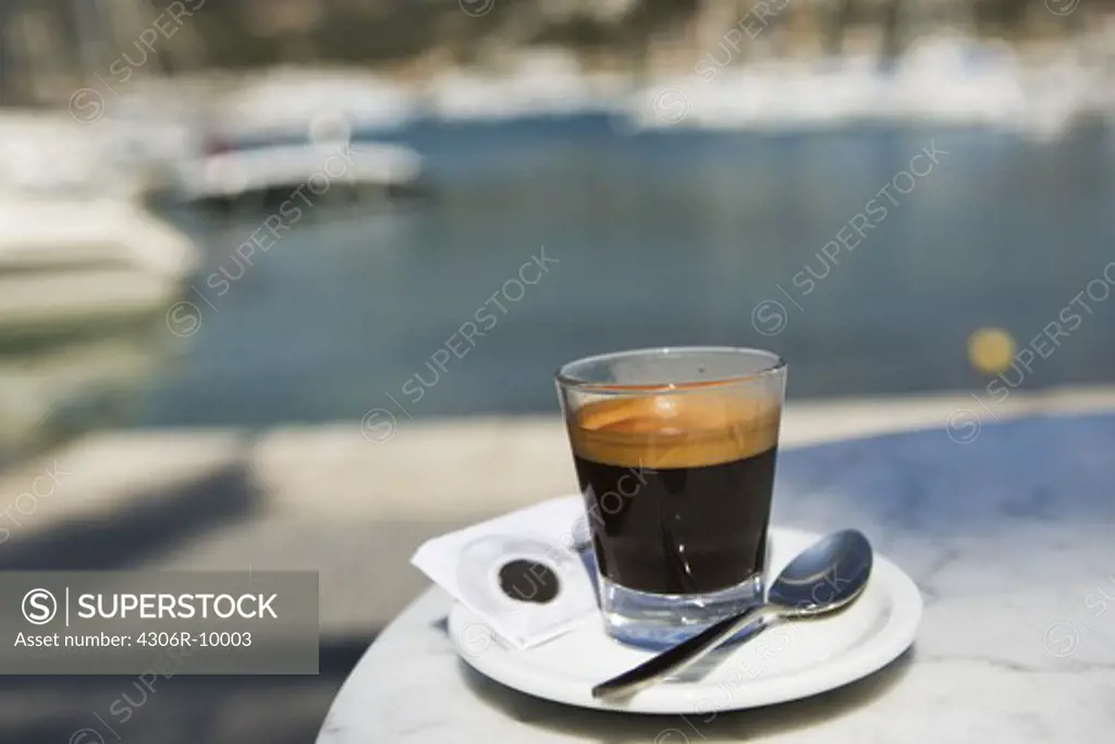 An espresso on a table.