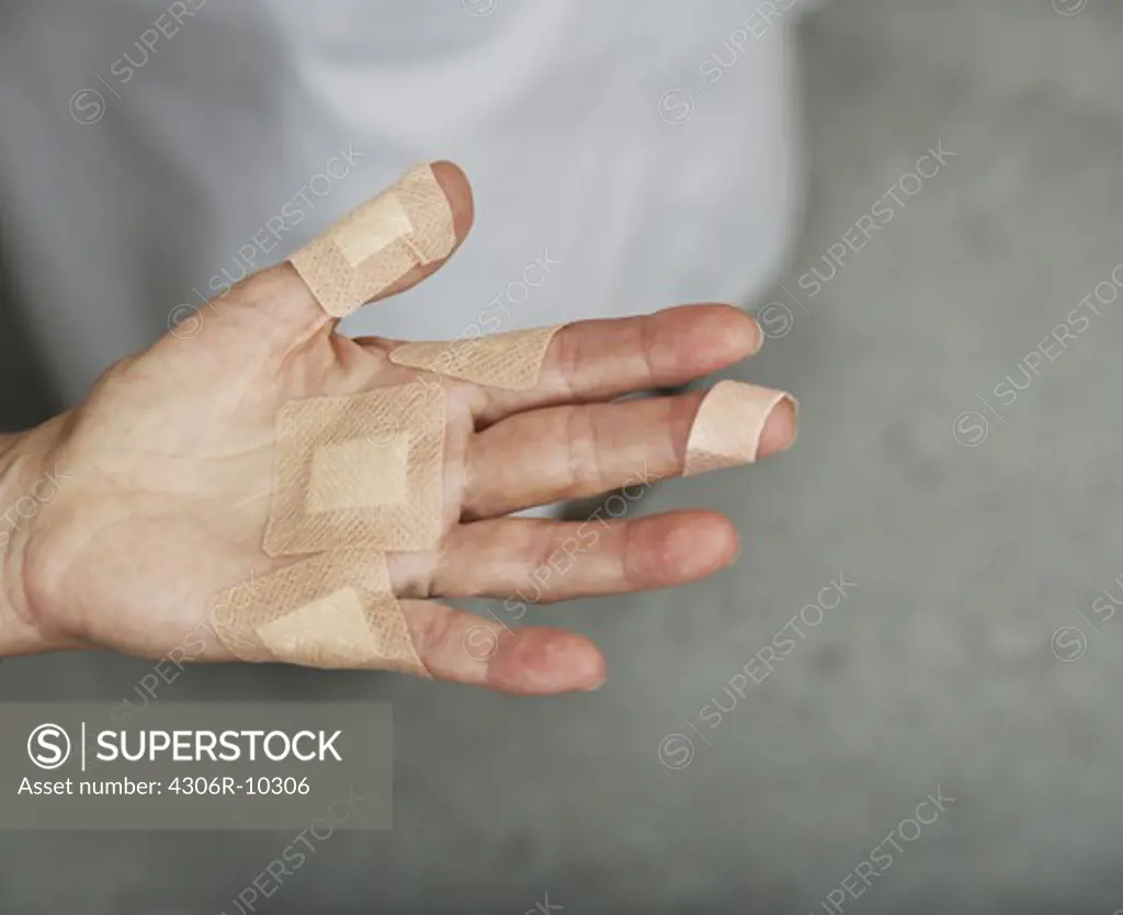 A hand with plaster.