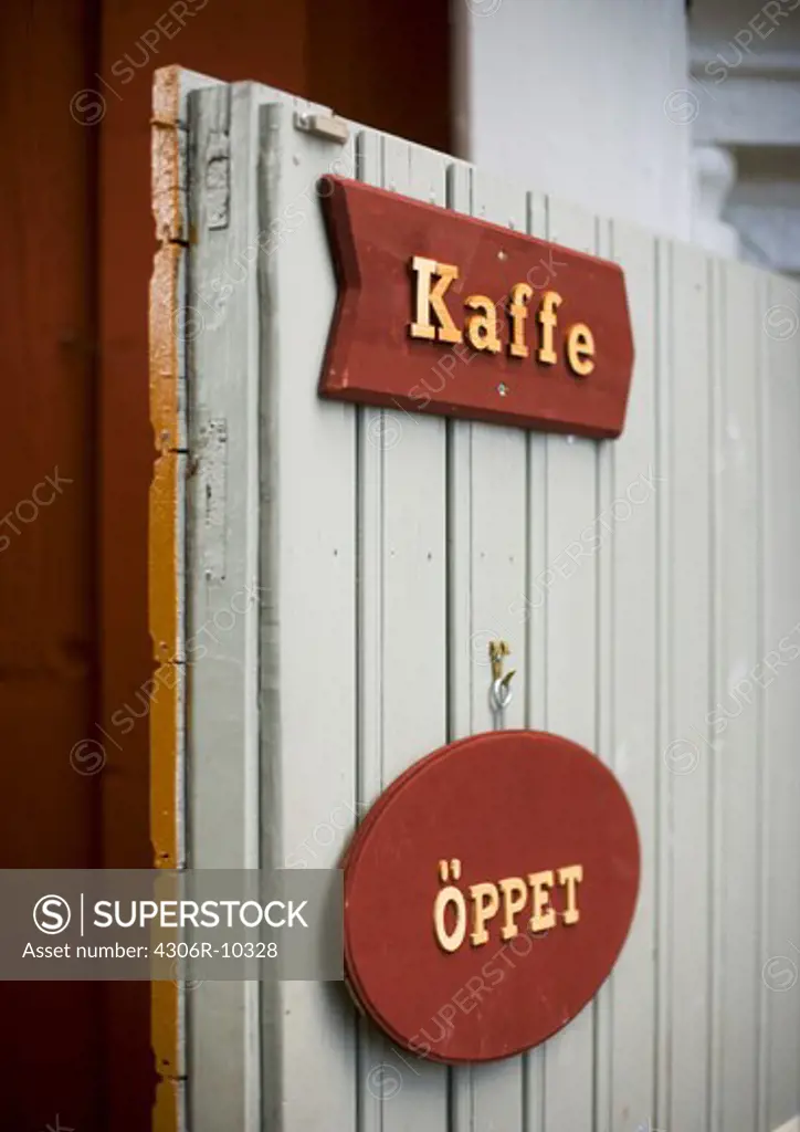 Sign to an open cafe.