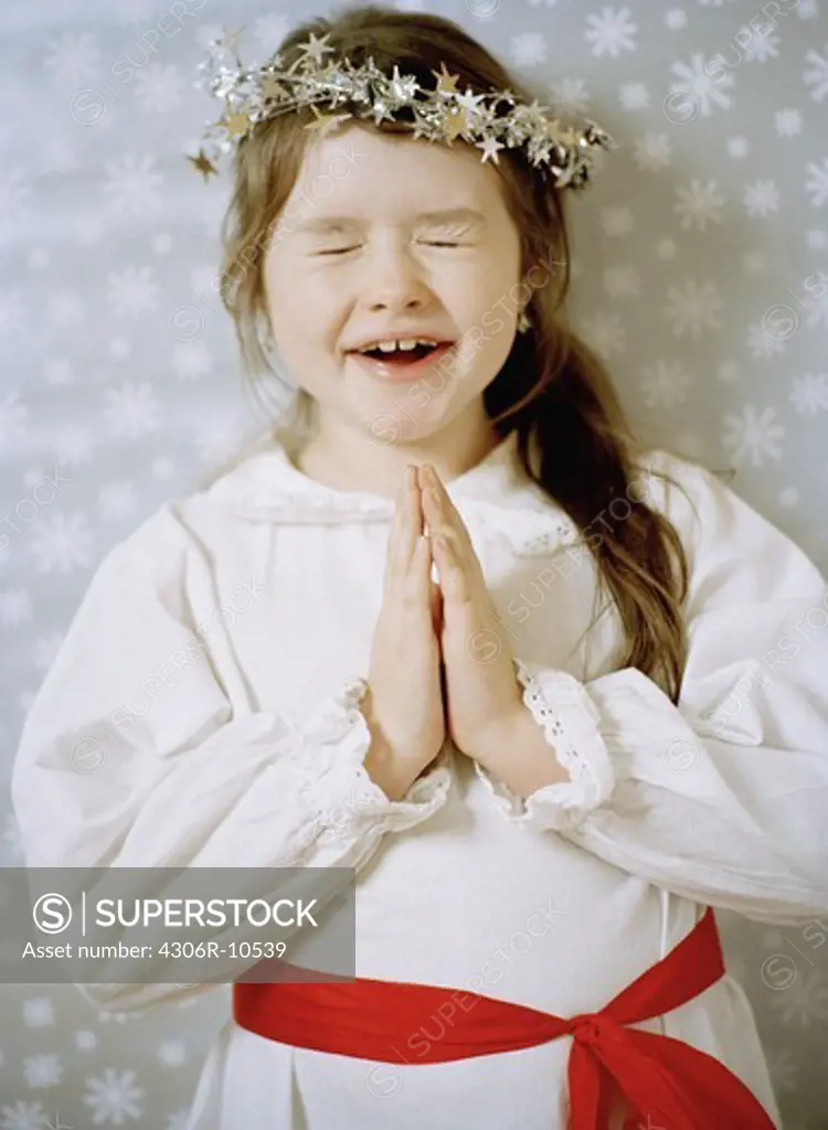 A girl celebrating Lucia in Sweden.