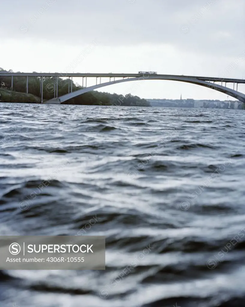 A bridge over grey water in Stockholm, Sweden.