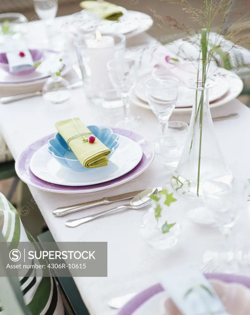 Formal table setting with flower on napkin, Stockholm, Sweden.