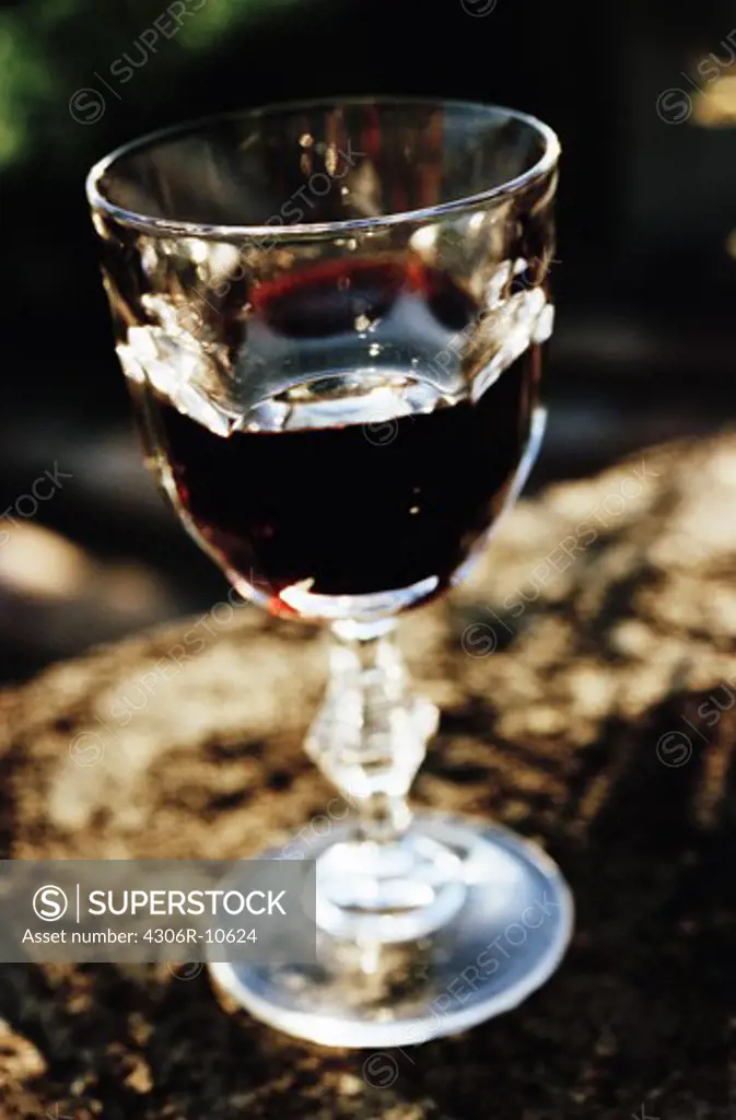 A glass of red wine.