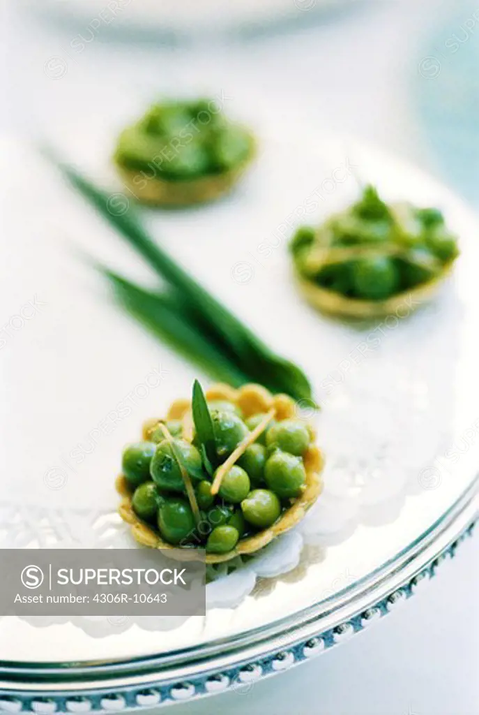 Small canapes with green peas.