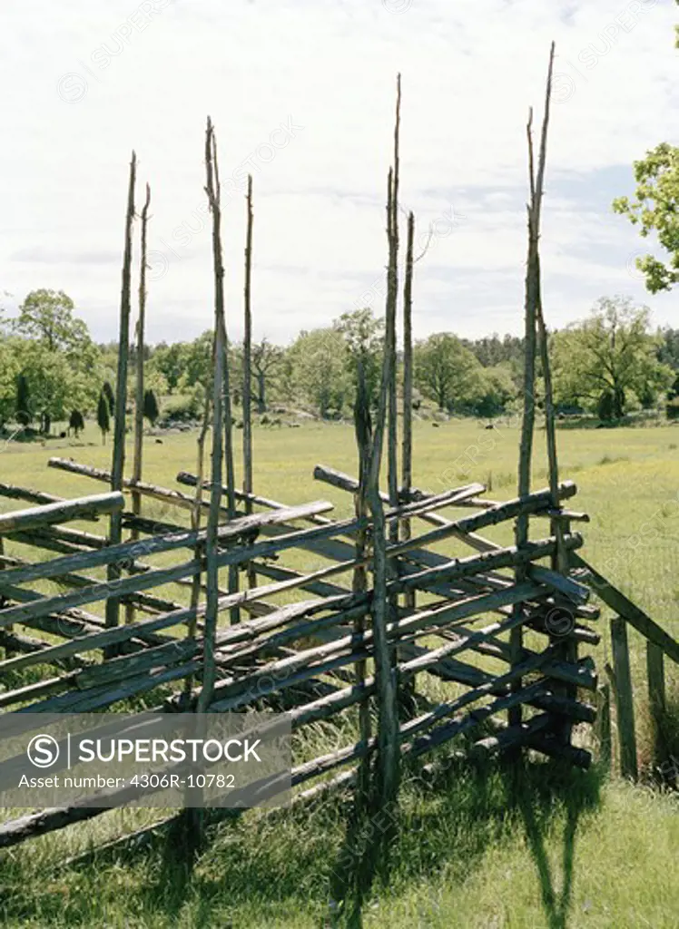 A split-rail fence with supports, Sweden.