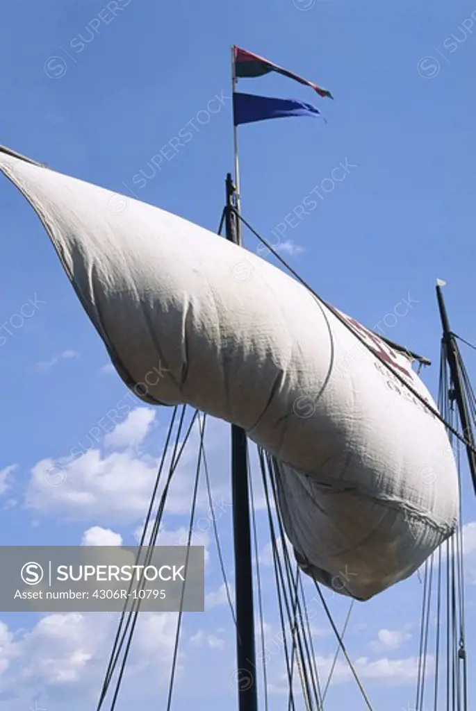 Hoisting sail on a Viking ship, Sweden.