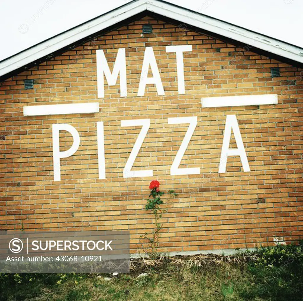 Food and pizza written on a house, Oland, Sweden.