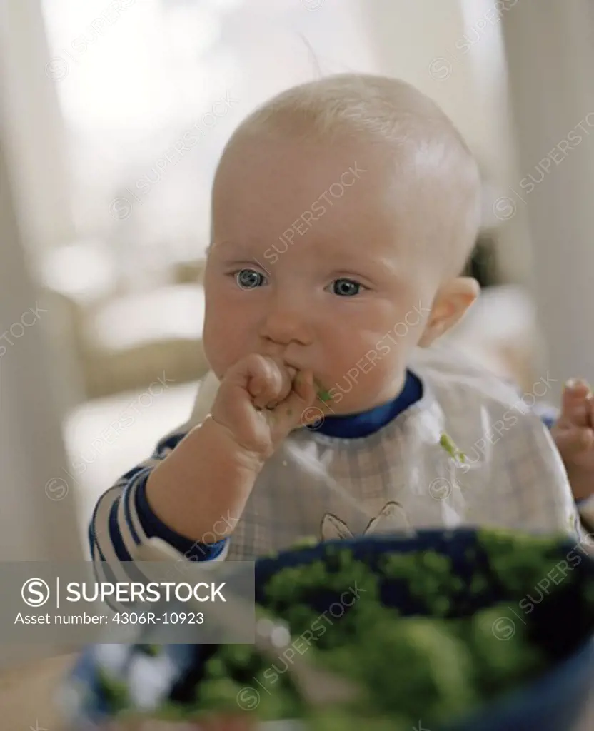 A baby eating, Sweden.