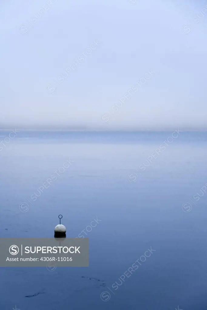 Buoy floating in sea, Nora, Sweden.