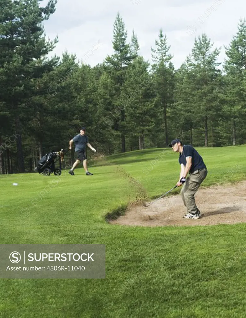 A man playing golf in Dalarnan Sweden.