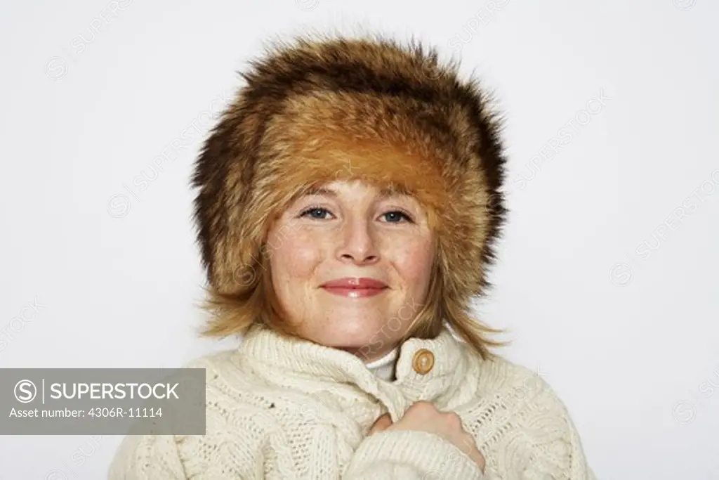 Portrait of a woman wearing a fur hat.