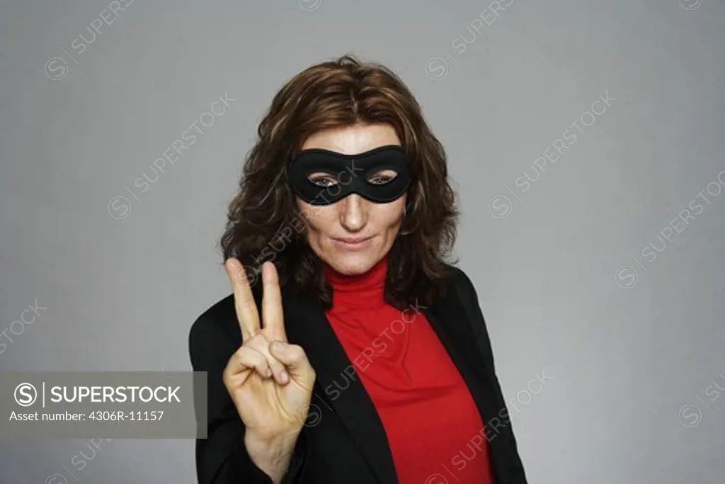 Portrait of a middle-aged woman wearing a mask.
