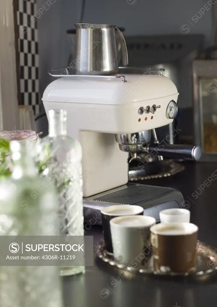 An espresso machine in a kitchen.