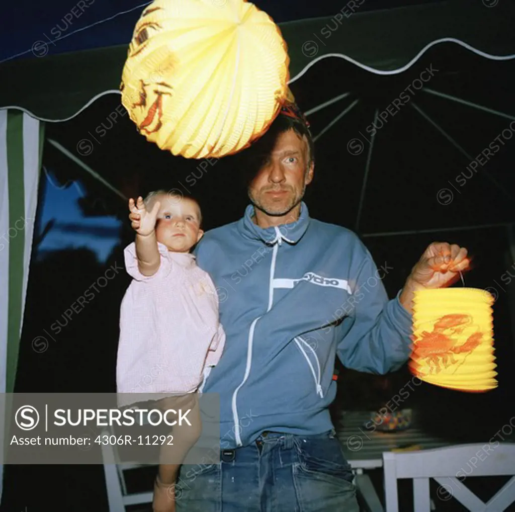 Father and daughter on a crafish party, Sweden.