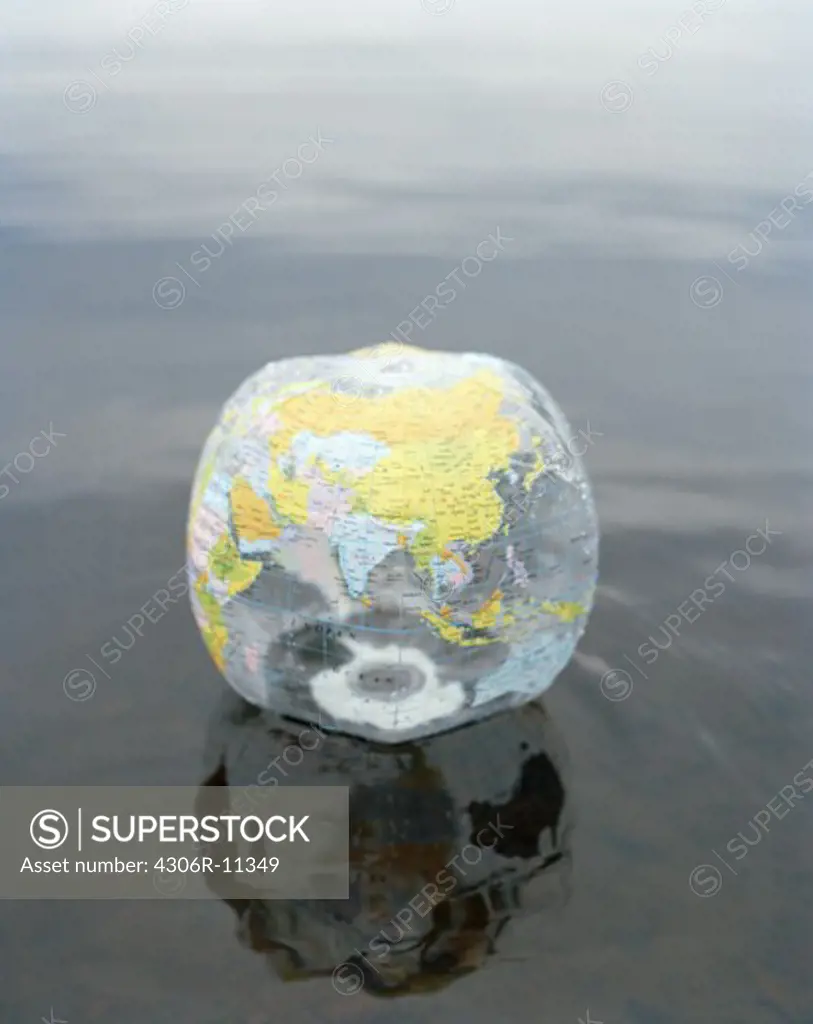 A beach ball with the globe, Smaland, Sweden.