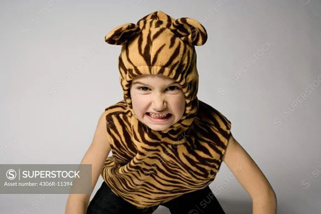 Portrait of a scandinavian boy dressed up as a tiger, Sweden.