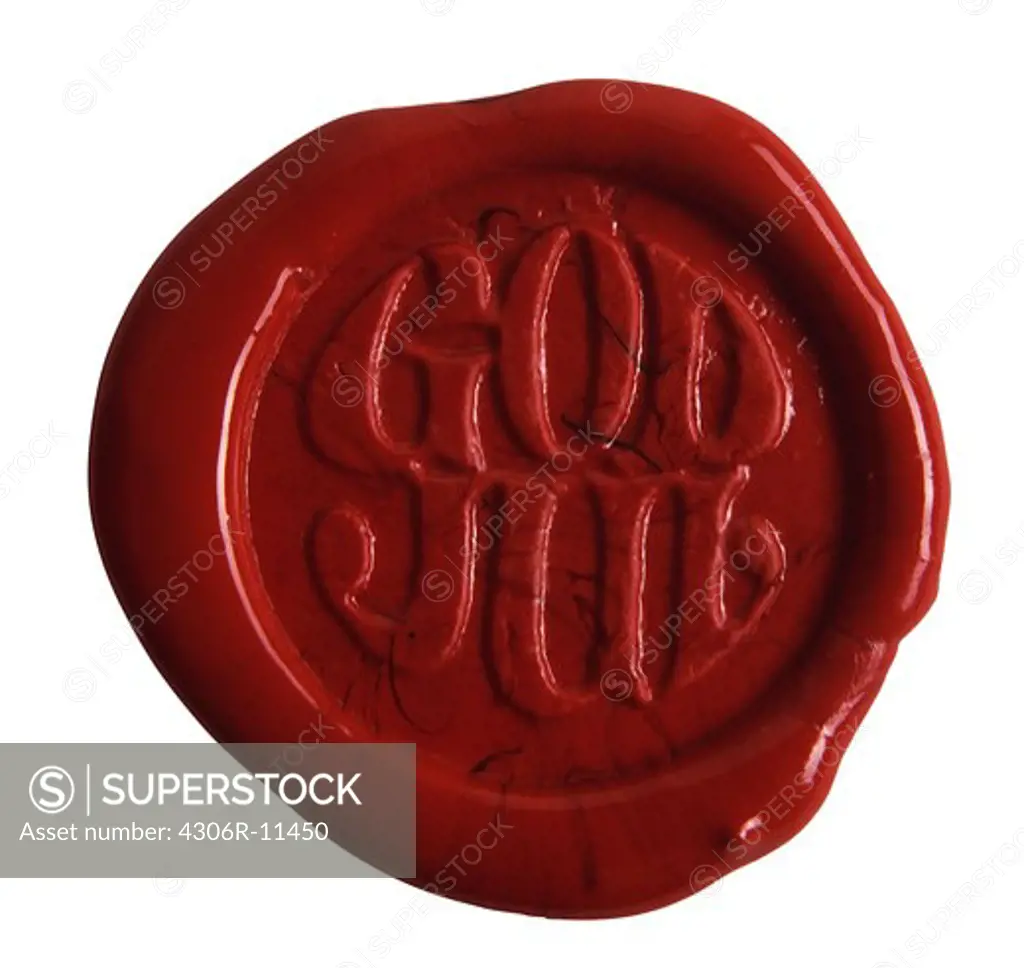 Red sealing wax that says God Jul, Merry Christmas in swedish.
