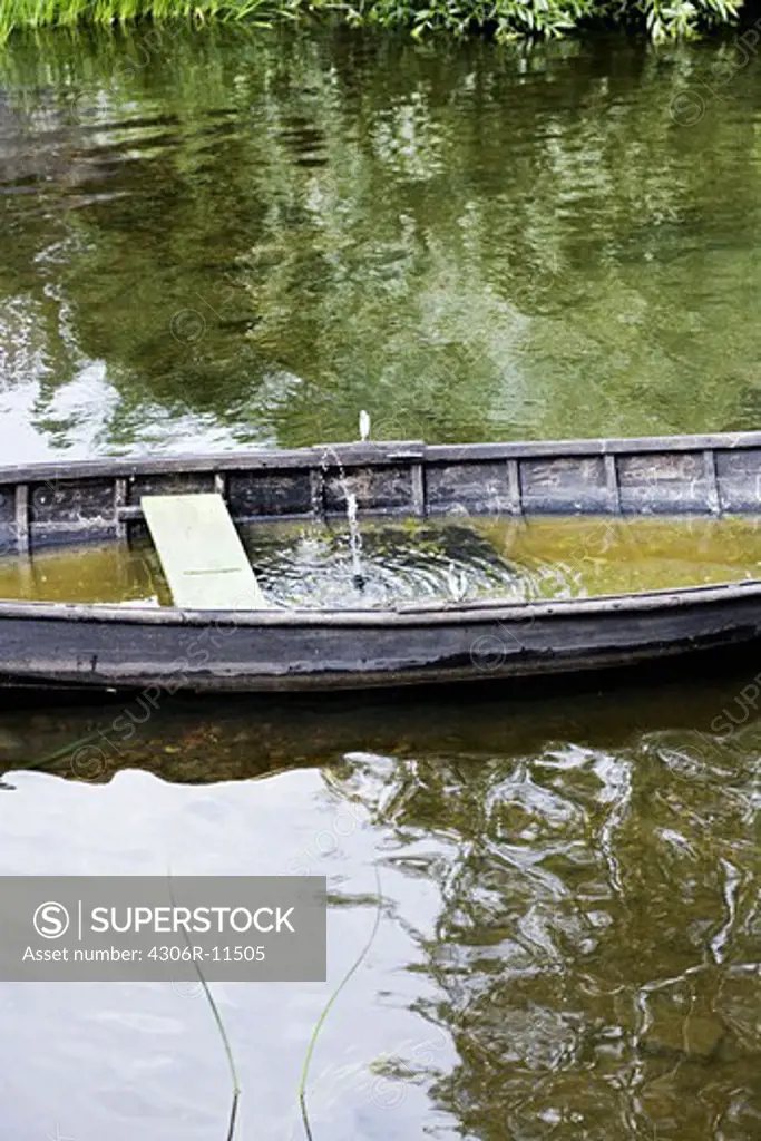 A rowing boat with water, Smaland, Sweden.