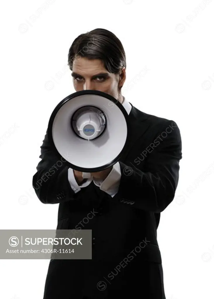 A man in a suit holding a megaphone, Sweden.