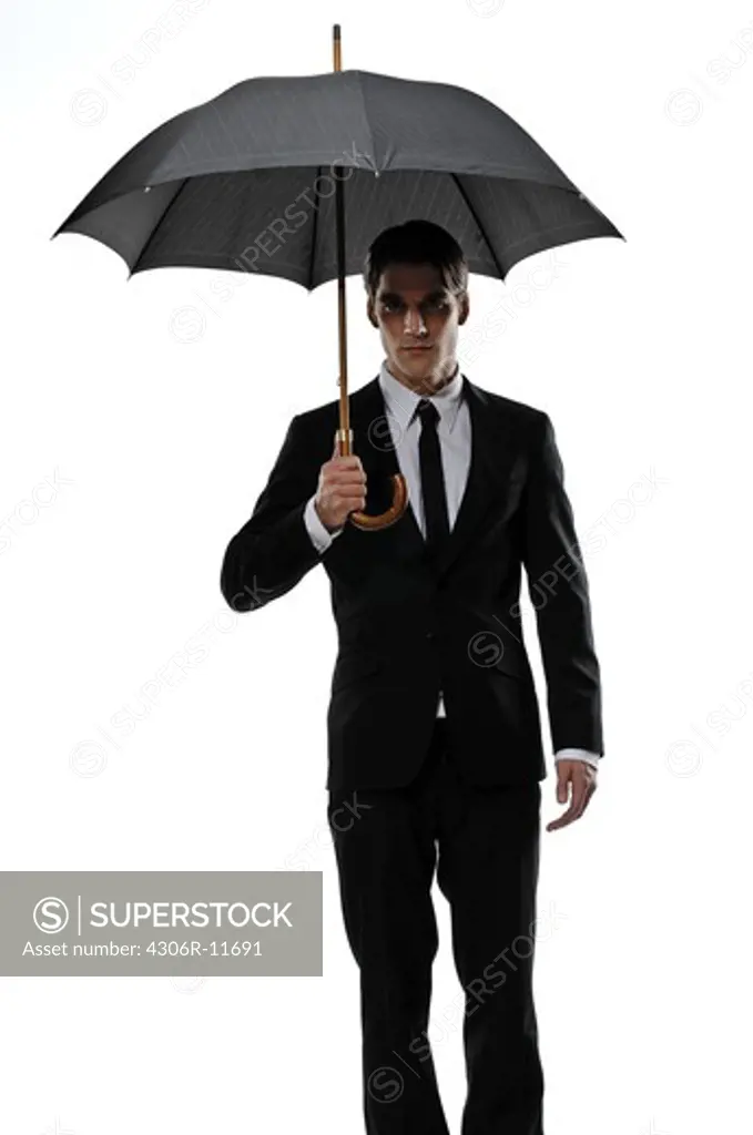 A man holding an umbrella.