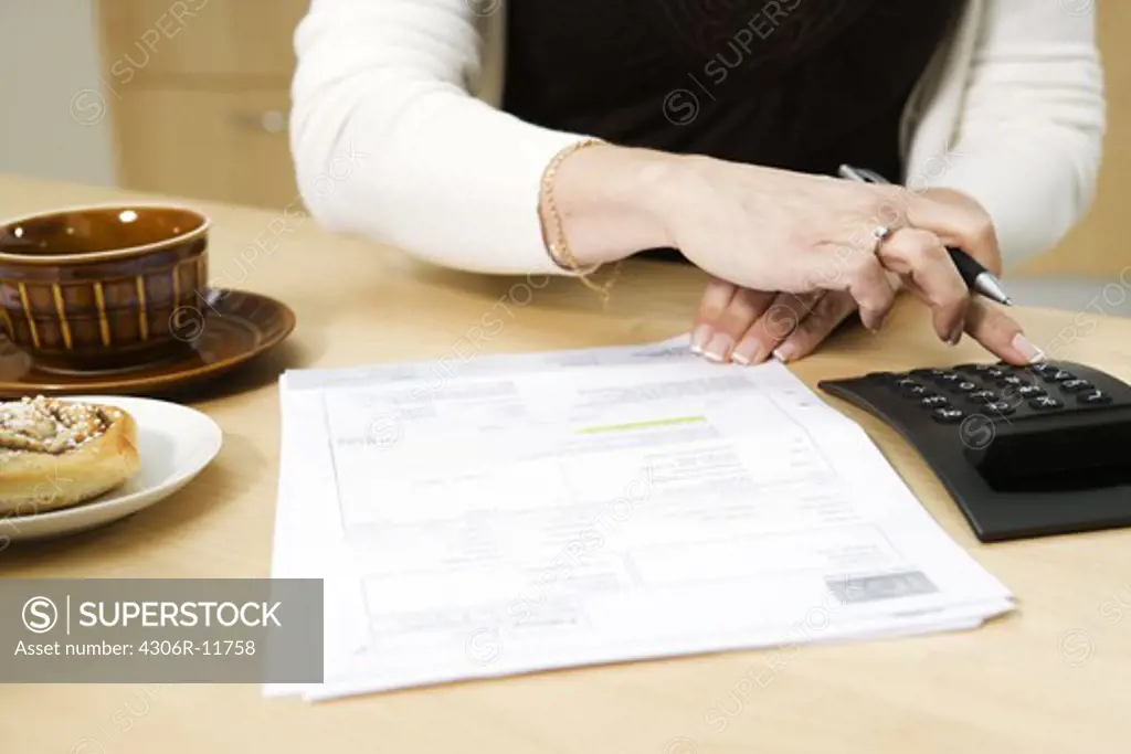 A woman paying her bills.