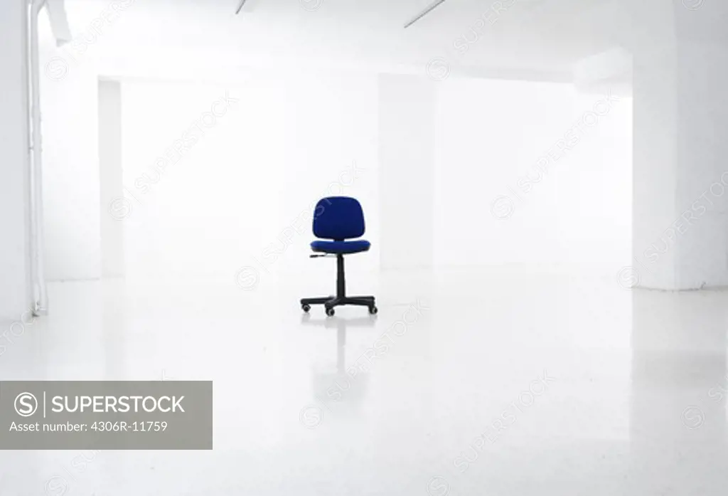 An office chair in an empty office.