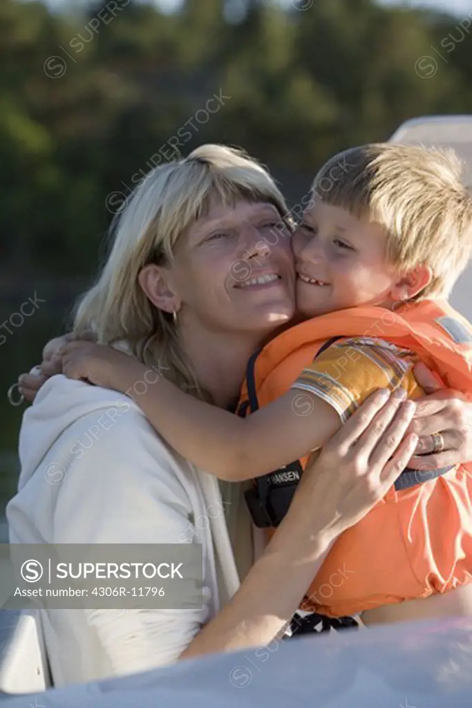Mother and son hugging, Sweden.
