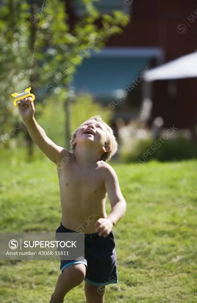 A boy kite-flying, Sweden.