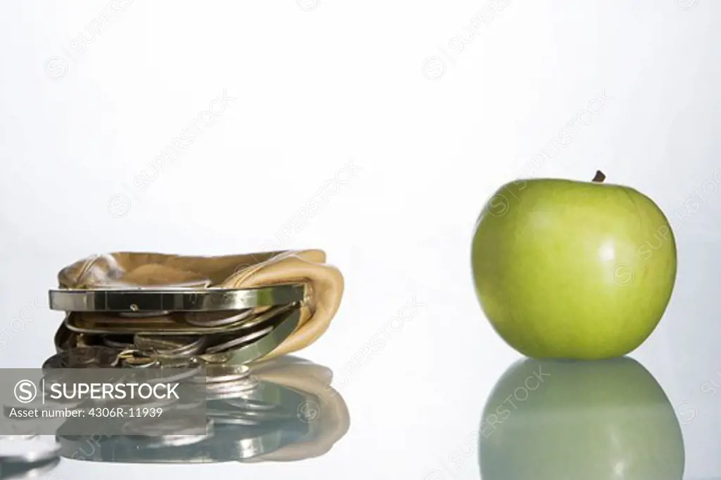 A wallet and an apple.