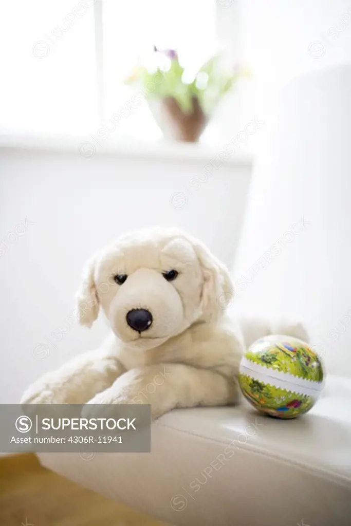 A teddy bear and an eastern egg.