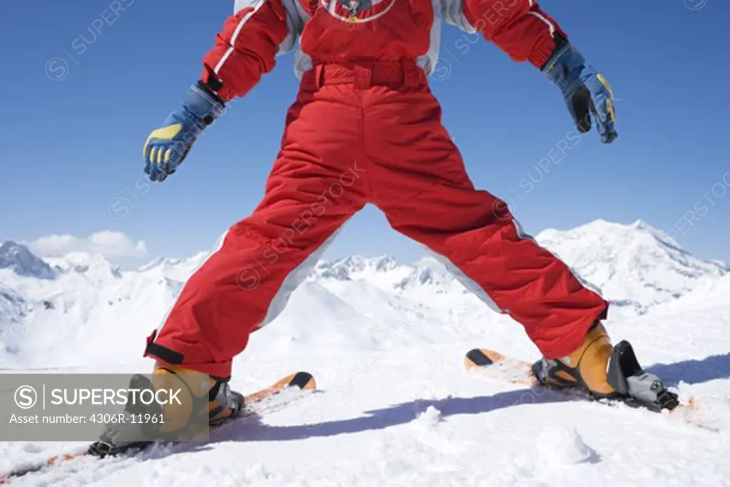 A boy skiing in the alps