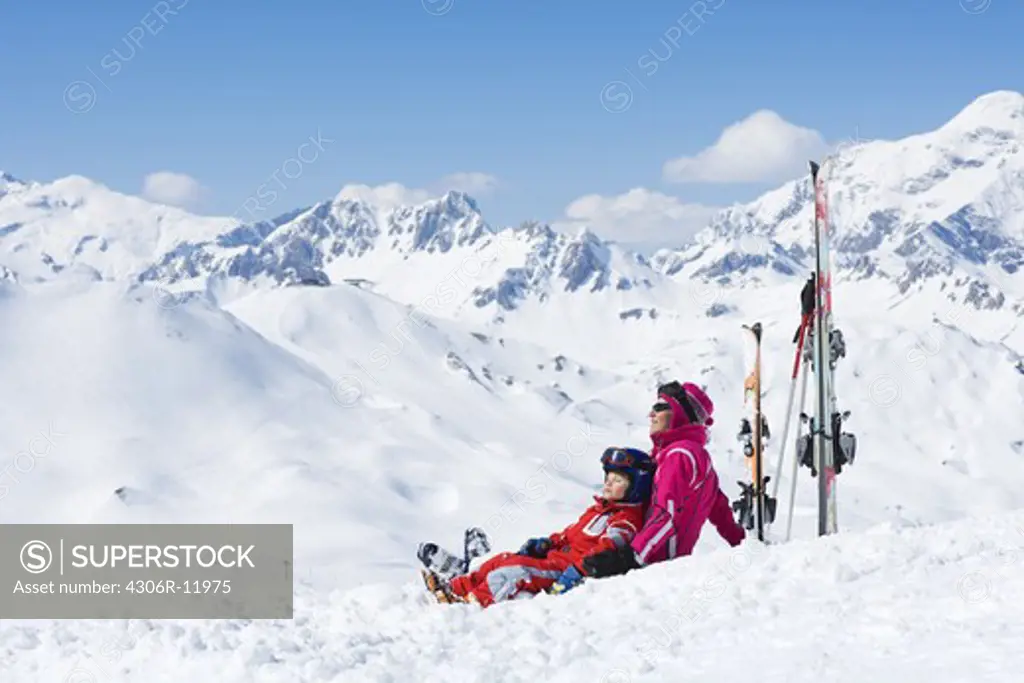 A mother and her sun resting on the slopes.