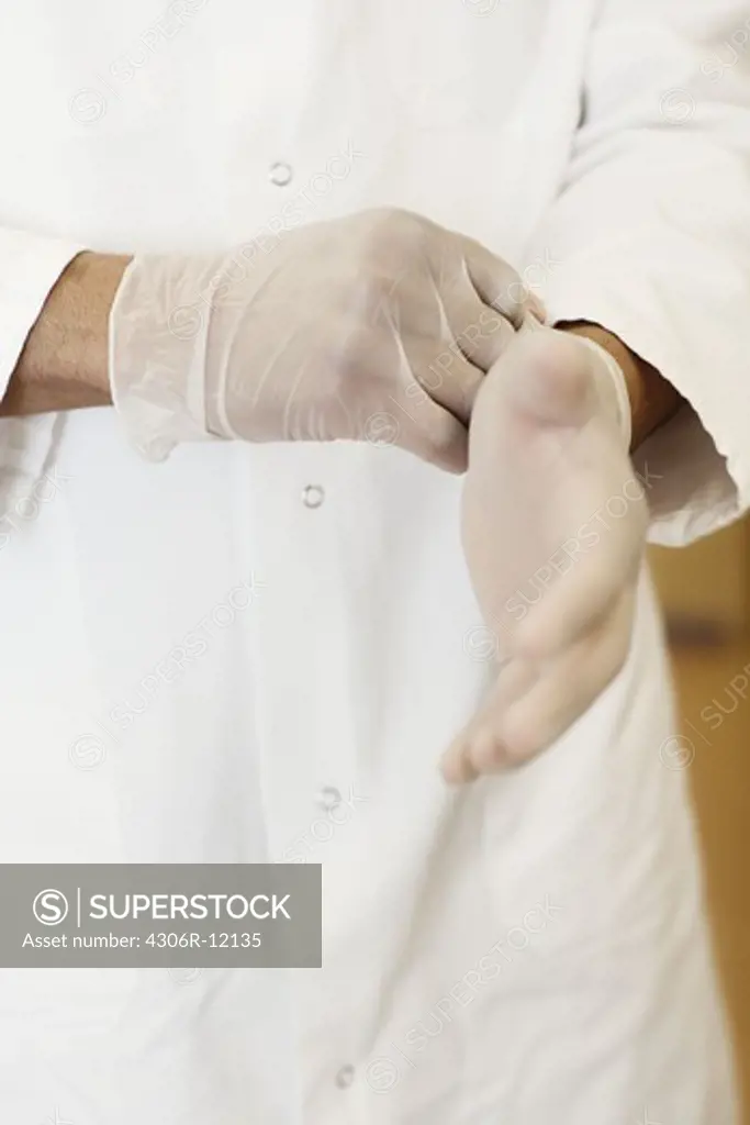 Gloves on the hands of a doctor.