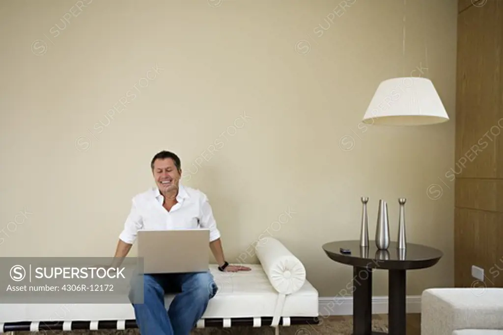 A Scandinavian man using a laptop, Brazil.