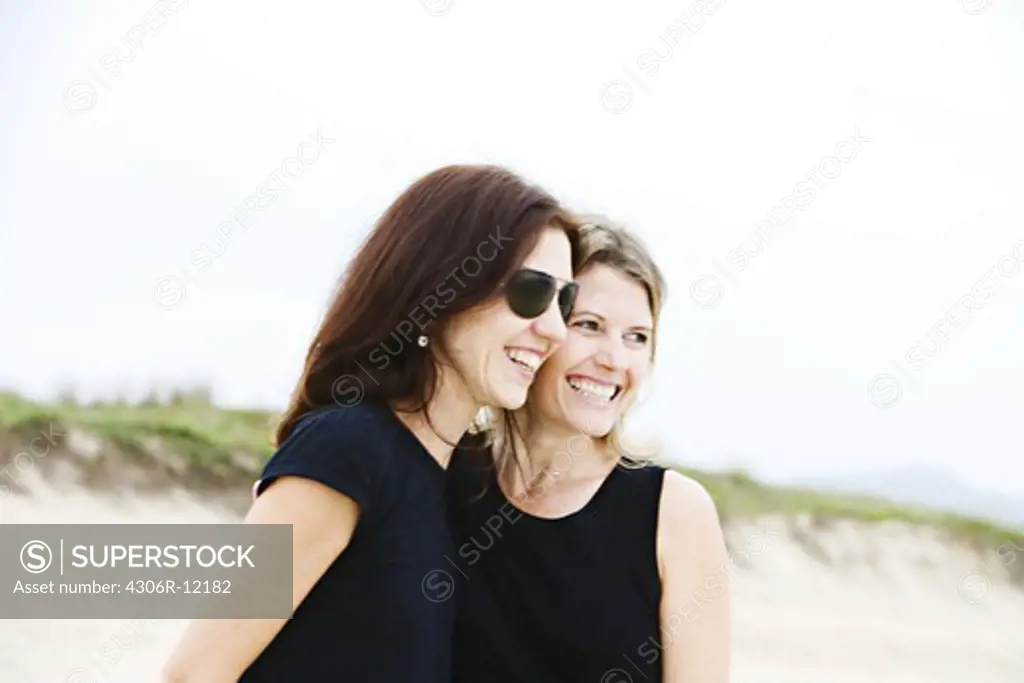 Two Scandinavian female friends on a beach, Brazil.