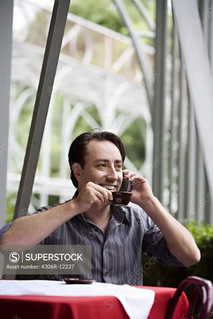 A man talking in a cellphone.