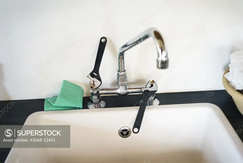 Adjustable spanners as taps in a washing-up zink, Sweden.