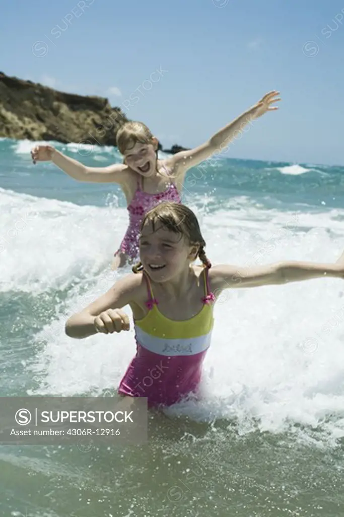 Two scandinavian girls bathing in the sea, Greece.