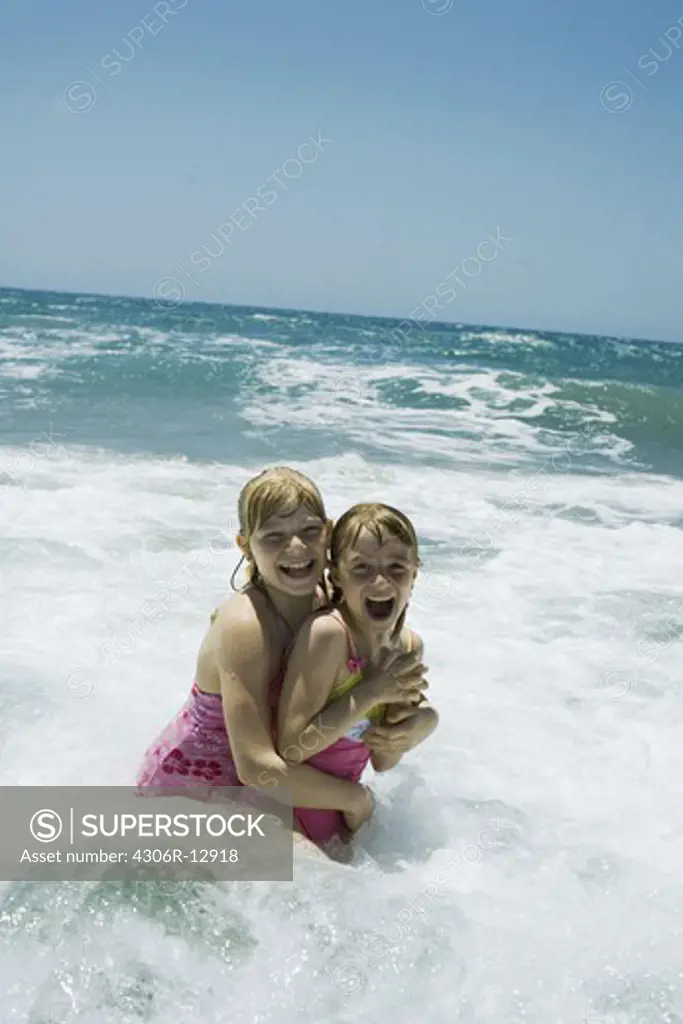 Two Scandinavian girls bathing in the sea, Greece.