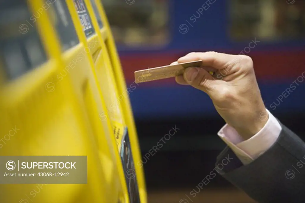 Businessman using his credit card, Stockholm, Sweden.